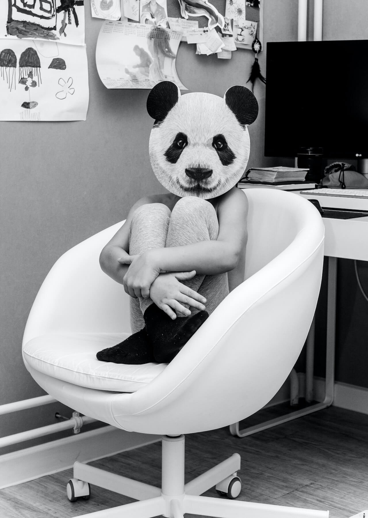 Panda human sitting in the chair